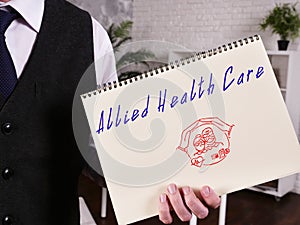 Allied Health Care sign on the piece of paper