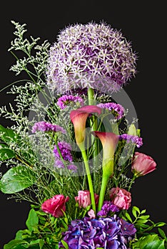 Allium giganteum with sea-lavender, callas, hydrangea, lisianthus on black background