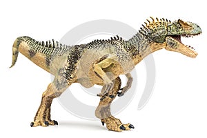 Allosaurus plastic figurine on white background