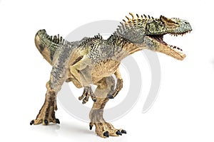 Allosaurus plastic figurine on white background