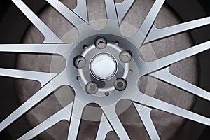 alloy car wheels in forged aluminum with knitting needles and titanium silver. Auto service industry and spare parts