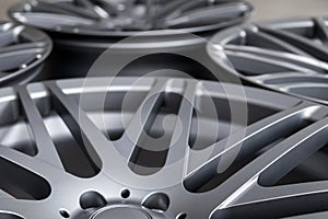 Alloy car wheels in forged aluminum with knitting needles and titanium silver. Auto service industry and spare parts