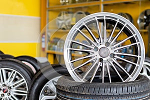 Alloy car wheels and pneumatic tires in store or service center