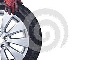 Alloy wheel with tyre and mechanic hand isolated