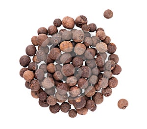 Allspice pile isolated on white background. Jamaican pepper, pimento berry, allspice peppercorns or myrtle pepper. Top