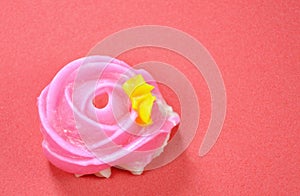 Allure colorful Thai candy with rose shape on red background