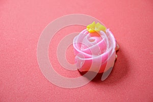 Allure colorful Thai candy with rose shape on red background