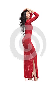 Alluring woman in evening dress posing