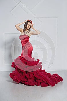 Alluring young lady posing in a studio