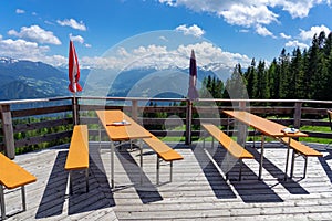 Alm hut hutte terrasse with benches in tyrol with mountain view photo