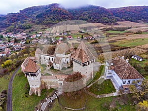 Alma Vii saxon fortified Church in Transylvania, Romania. Artist