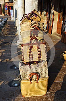 Baskets and bags of esparto, traditional Spanish crafts in Plaza Mayor of Almagro, Spain photo