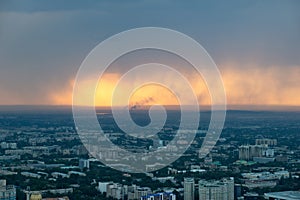 Almaty Skyline during a Sunset Rain, Kazakhstan in August 2018 t