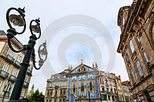 Almeida Garrett Square with San Antonio dos congregados church and Sao Bento railway station buildings in Porto city