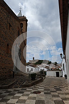 Vertical view. Church of San Martin with the mosque in the background in Almonaster la Real, Huelva, Spain photo