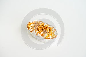 Almond caramel cake on white background