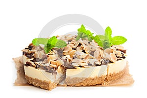 Almond cheesecake with chocolate flakes isolated on white