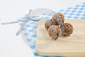 Almond chocolate candy isolated on wood