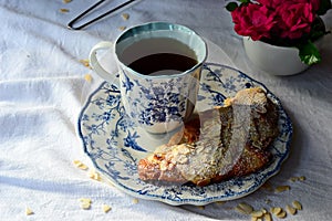 Almond croissant with tea for breakfast