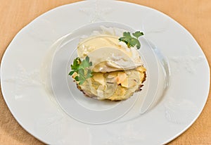 almond crusted crab cake, with a pouched egg, almond sauce