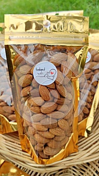 Almond dried in gold envelopes, ready to eat, dried whole grains, healthy snacks for everyone.