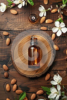 Almond essential oil in a bottle. Selective focus.