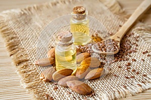 Almond essential oil in a small bottle. Selective focus