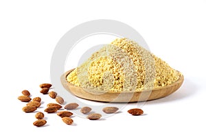 Almond flour, on a wooden plate, almond nut, on a white background, copy spase, no people, horizontal