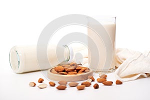 Almond milk with almond seeds isolated on white background, Health drink concept, for vegan food