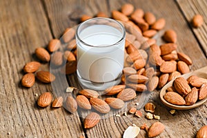 Almond milk and Almonds nuts wooden background, Delicious sweet almonds on table, roasted almond nut for healthy food and snack