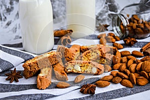 Almond milk in bottles with Cantuccini Cookie Biscuits with Almonds, cinnamon and anise, almond seeds