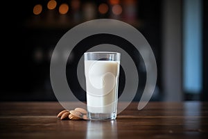 almond milk in a clear glass with backlit glowing effect