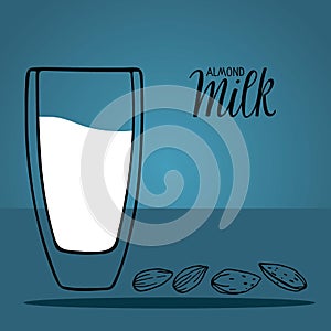 Almond milk glass and almond seeds isolated on blue background with inscription. Dairy alternative milk for detox