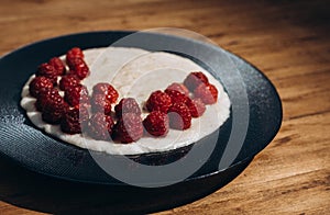 almond milk oatmeal with fresh raspberries