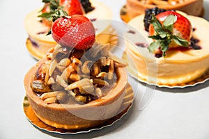 Almond nut tart on top fresh strawberry and blueberry cheese