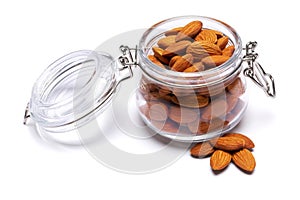 Almond nuts in a glass bowl isolated on a white background