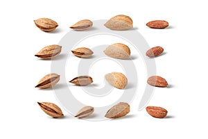 Almond nuts, shelled and hulled on white background.
