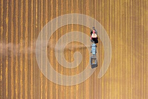 Almond picker harvester processing a field, Aerial view.