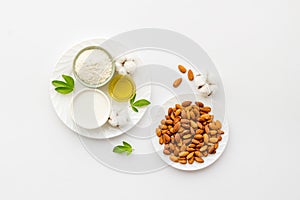 Almond products - milk oil and flour with seeds, top view