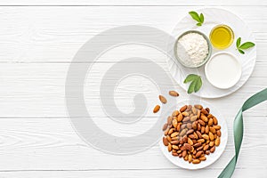 Almond products - milk oil and flour with seeds, top view