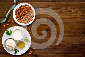 Almond products - milk oil and flour with seeds, top view