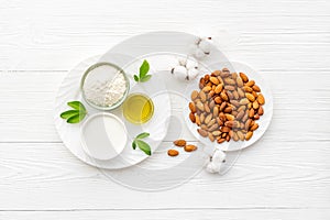 Almond products - milk oil and flour with seeds, top view