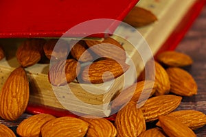 Almonds, almond group, almonds in red book. Natural, food.