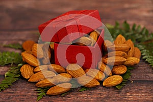 Almonds, almond group, almonds in red gift box. Natural, food.