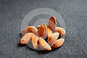 Almonds on a black table