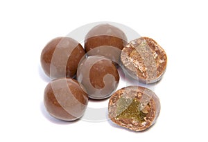 Almonds in chocolate glaze on a white background.