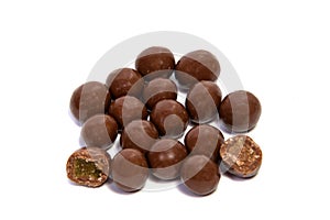 Almonds in chocolate glaze on a white background.