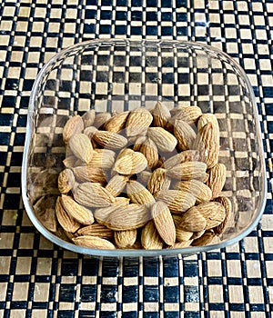 Almonds dry fruits healthy food served in a glass bowl