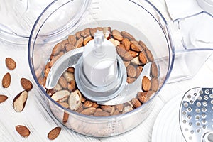 Almonds in a food processor ready to be crushed photo
