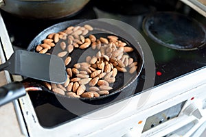Almonds fried in a skillet